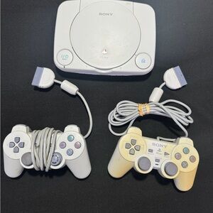 Sony PlayStation Console with Dual Gray Controllers